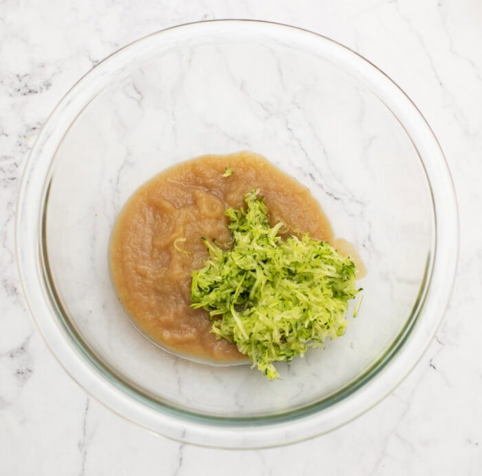 Zucchini, applesauce and maple syrup in a glass bowl