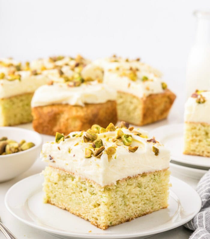 A slice of zucchini cake on a white plate