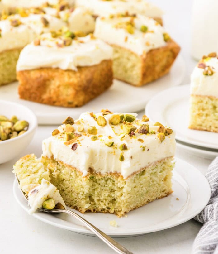 A bite taken from a slice of zucchini cake