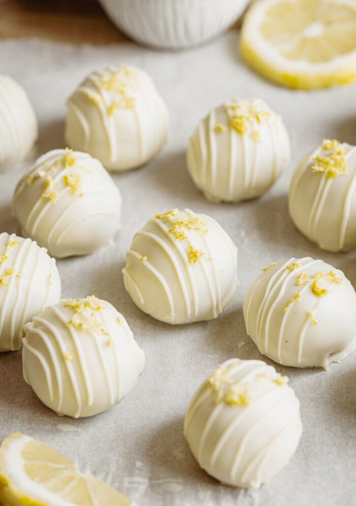 Lemon cake truffles drizzled with white chocolate and lemon zest