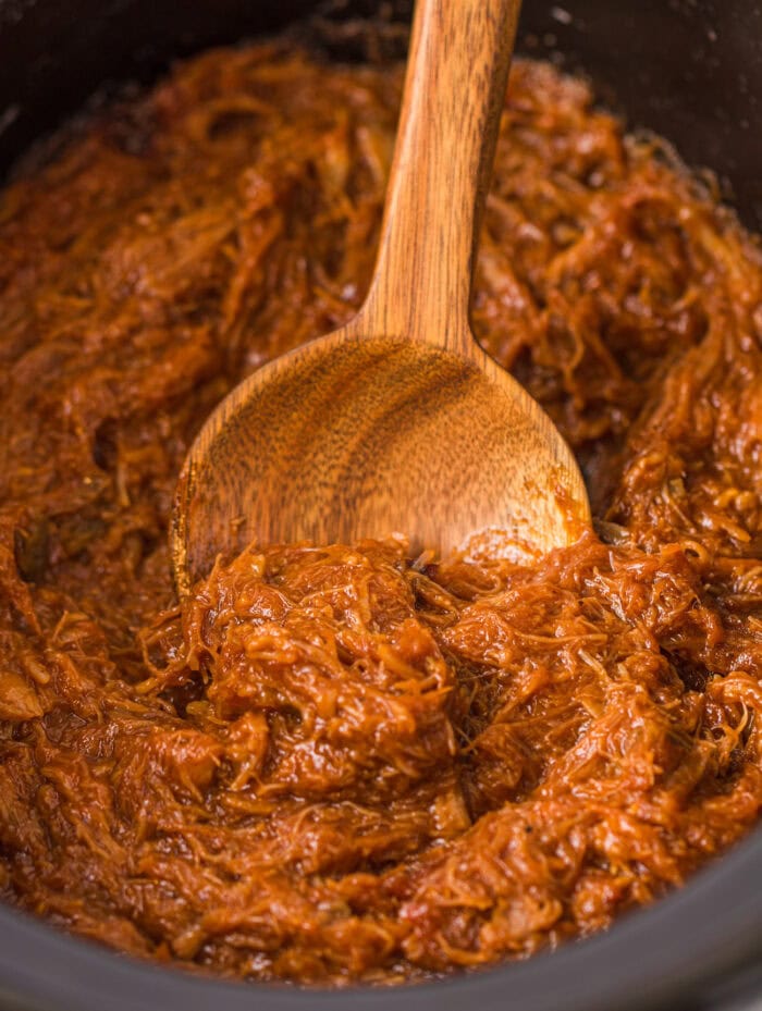 Pulled pork with a wooden spoon