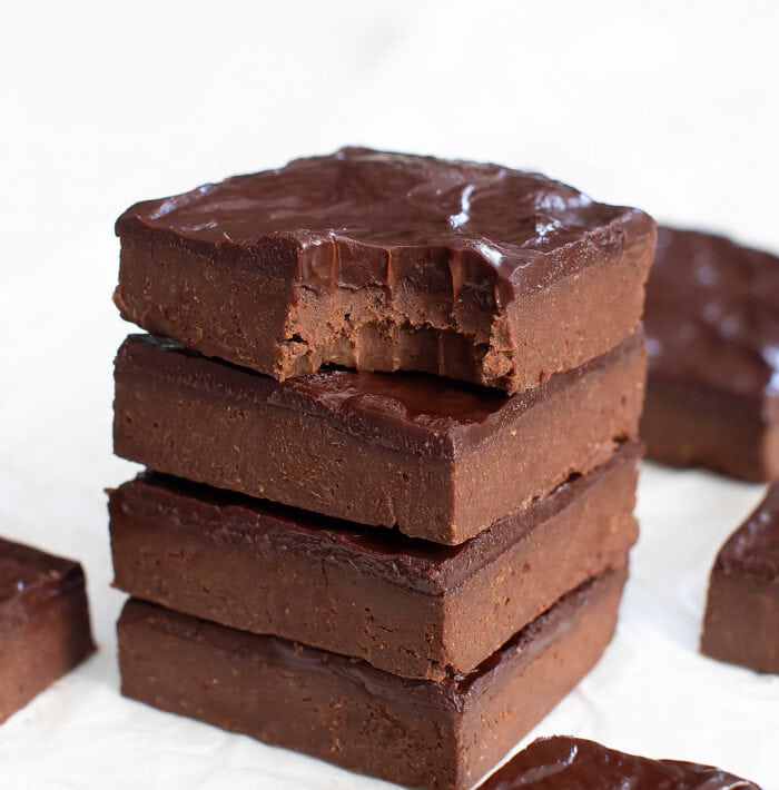 A bite taken from a brownie with frosting