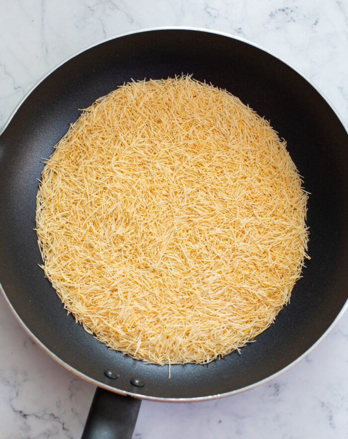 Golden-brown toasted kataifi strands in a skillet