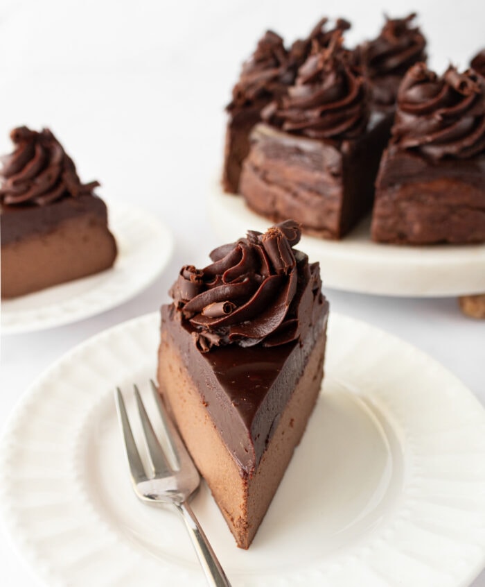 A slice of Chocolate Cheesecake on a plate with a fork