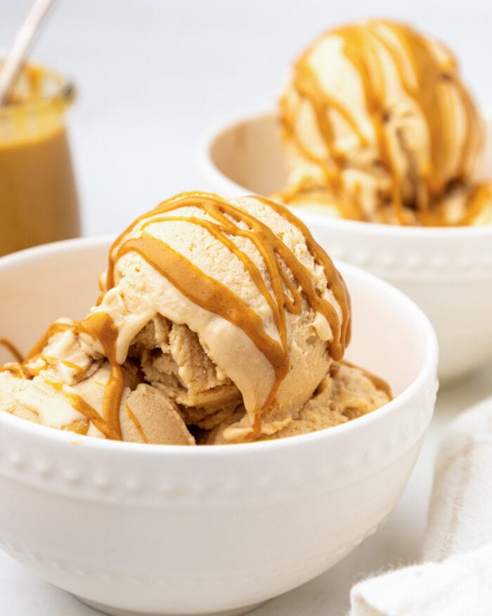 Ice cream in a bowl with a peanut butter drizzle