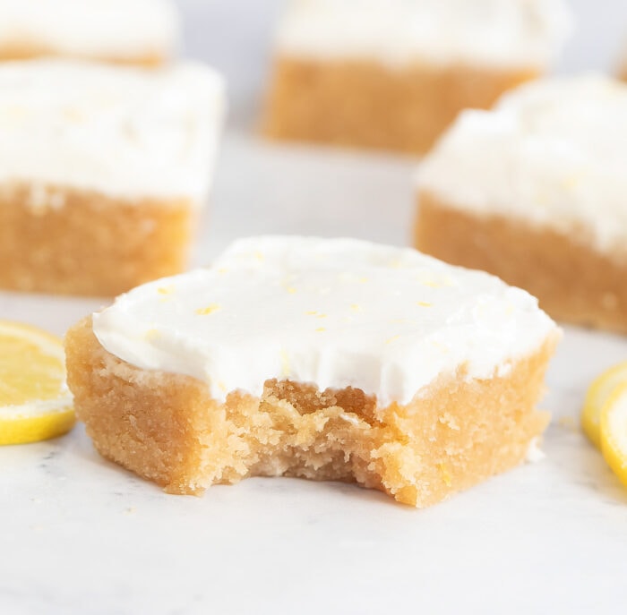 A bite taken from a lemon brownie