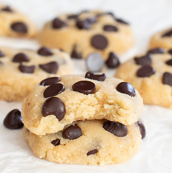 A bite taken from a chocolate chip cookie