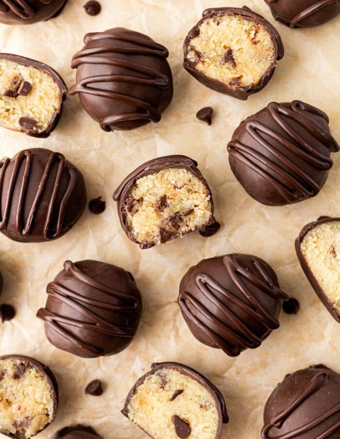 Cookie Dough Truffles cut in half and some drizzled with chocolate
