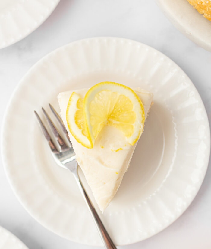 A slice of lemon cake with buttercream frosting