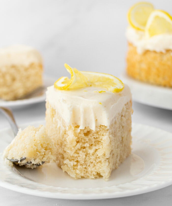 A bite taken from a slice of lemon cake