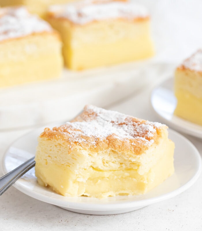 A slice of magic cake with a bite taken from it