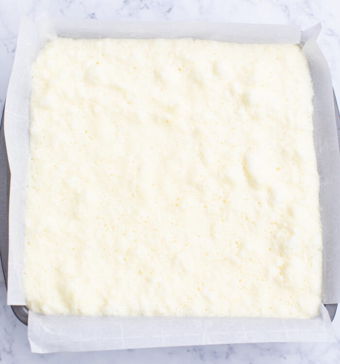 Cake batter in a square baking pan