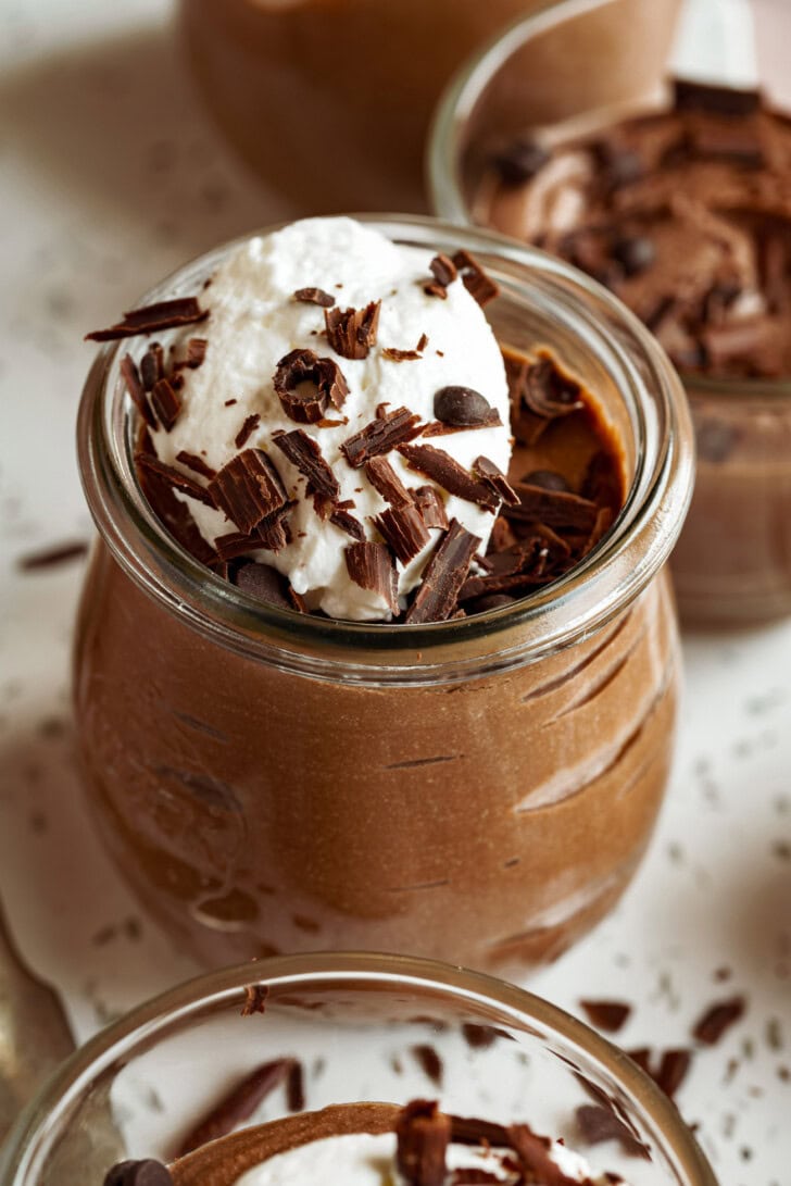 Chocolate mousse with whipped cream and chocolate shavings on top