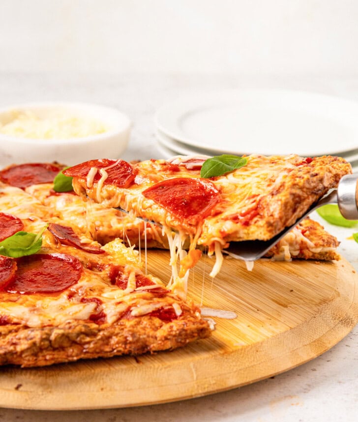 A slice of pizza on a server