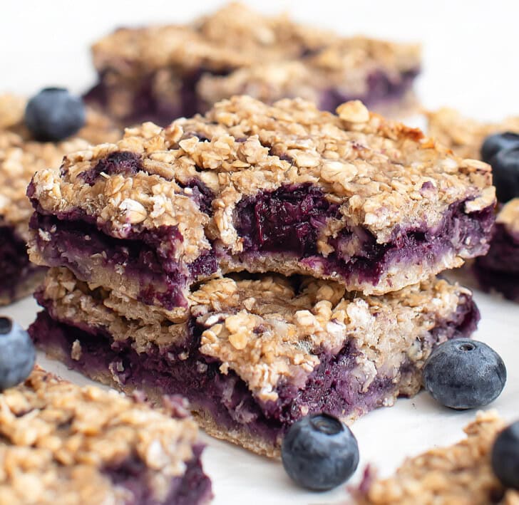 A bite taken from a blueberry oatmeal bar
