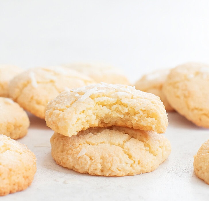 A bite taken from a coconut cloud cookie