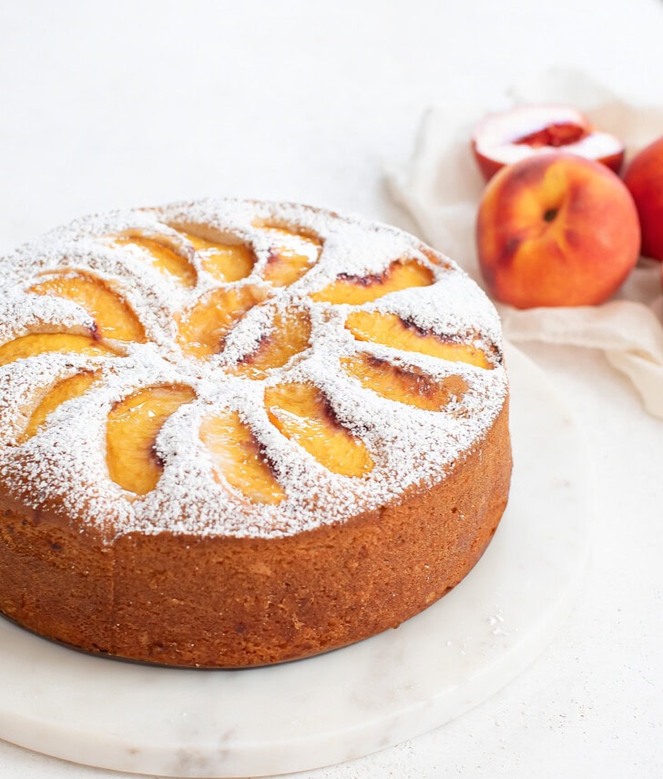 Peach cake dusted with powdered sweetener