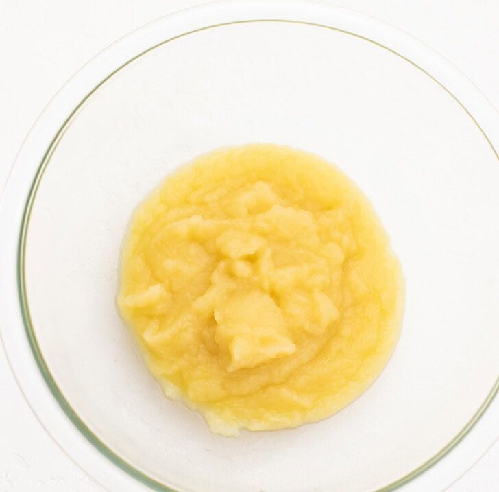 Applesauce in a glass mixing bowl