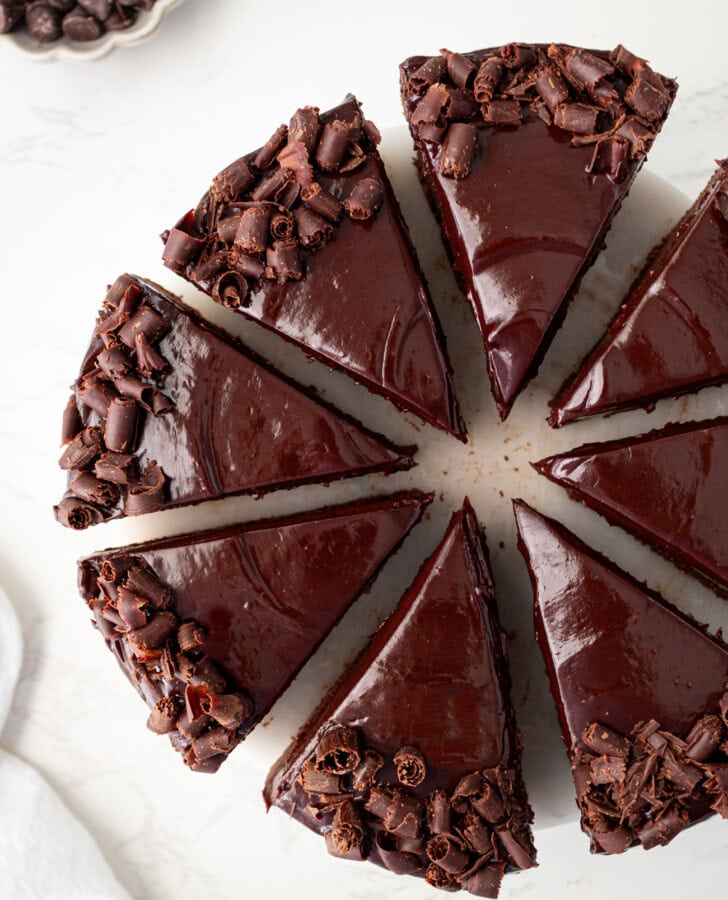 Chocolate cake slices decorated with chocolate frosting and chocolate curls