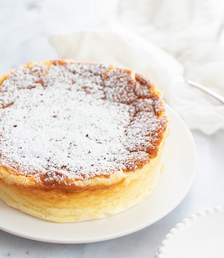 A Cottage Cheese Cake dusted with powdered sugar