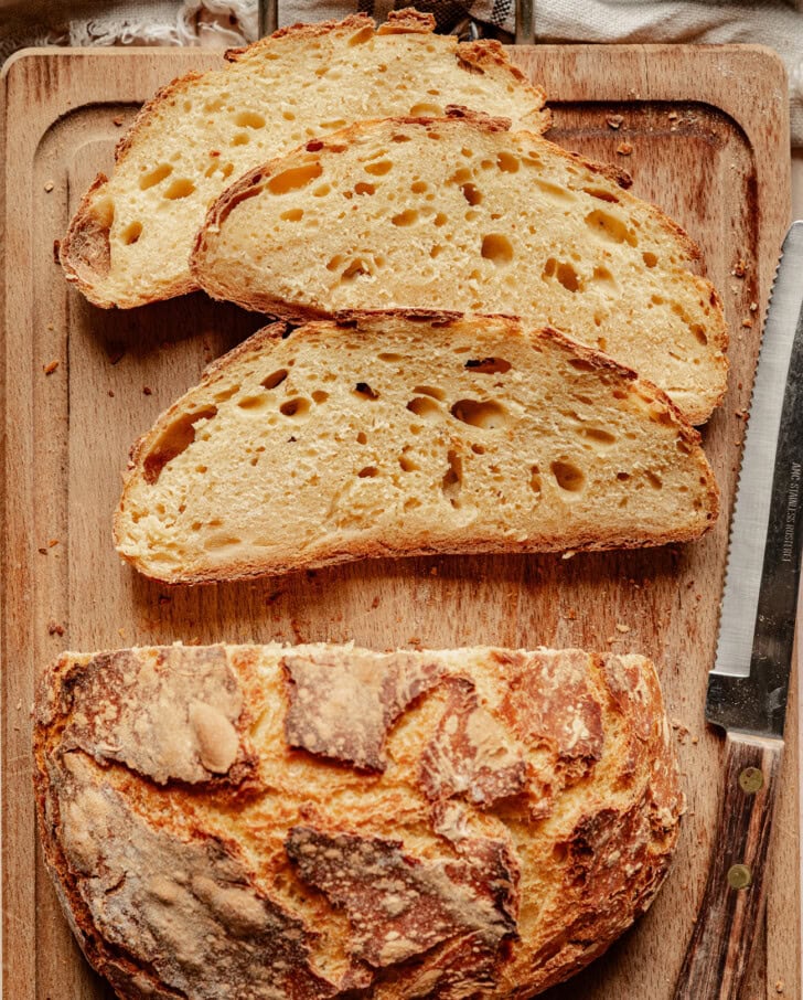 Slices of pumpkin bread on a wood cutting board