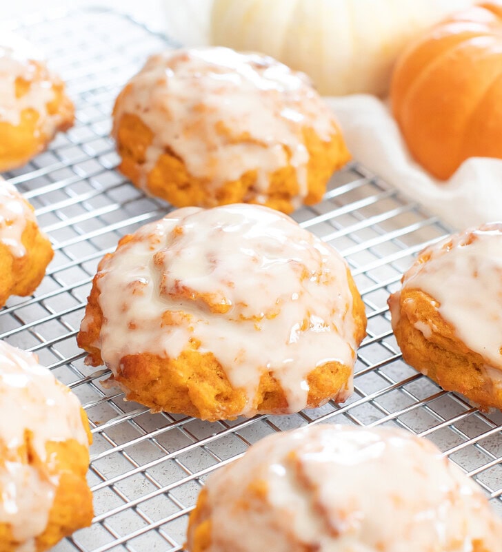 Soft and fluffy pumpkin fritters with a glaze