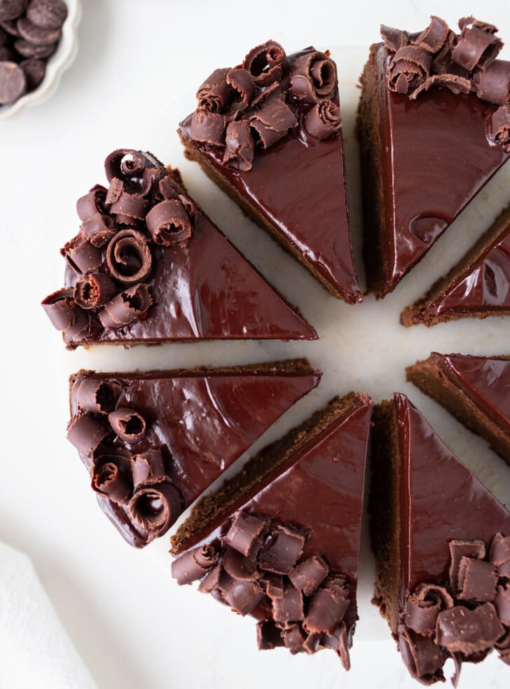 Decorated chocolate cake cut into eight slices