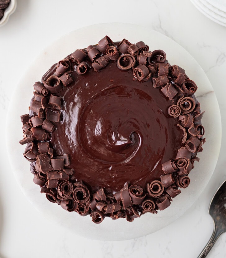 Chocolate cake decorated with frosting and chocolate curls