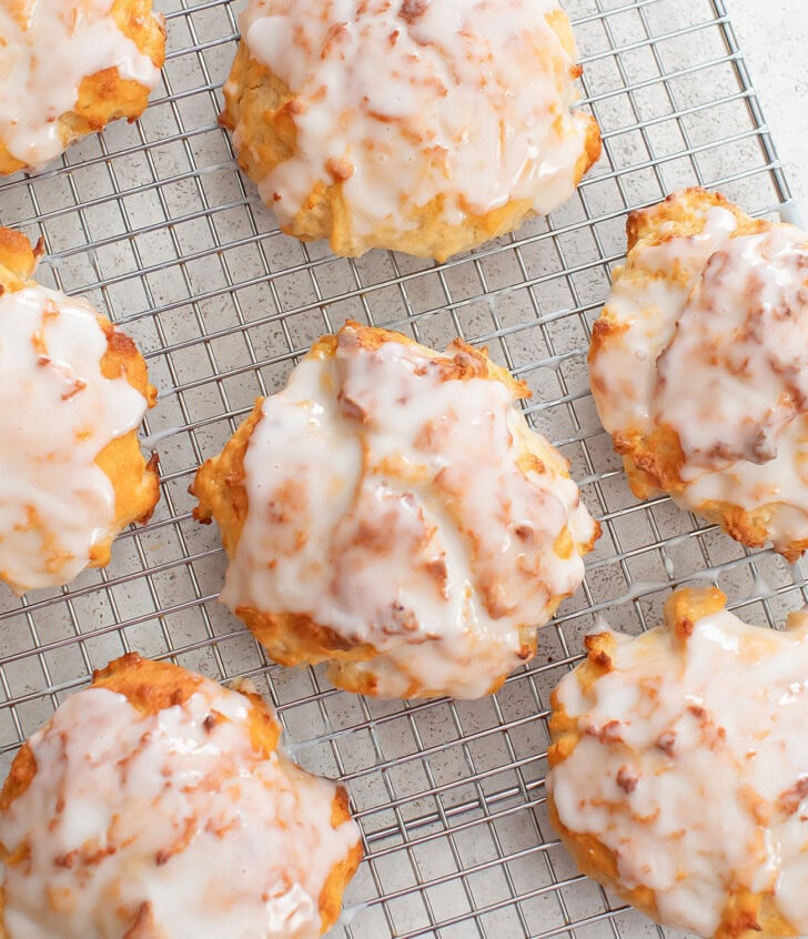 Fritters on a cooling rack with a glaze on top