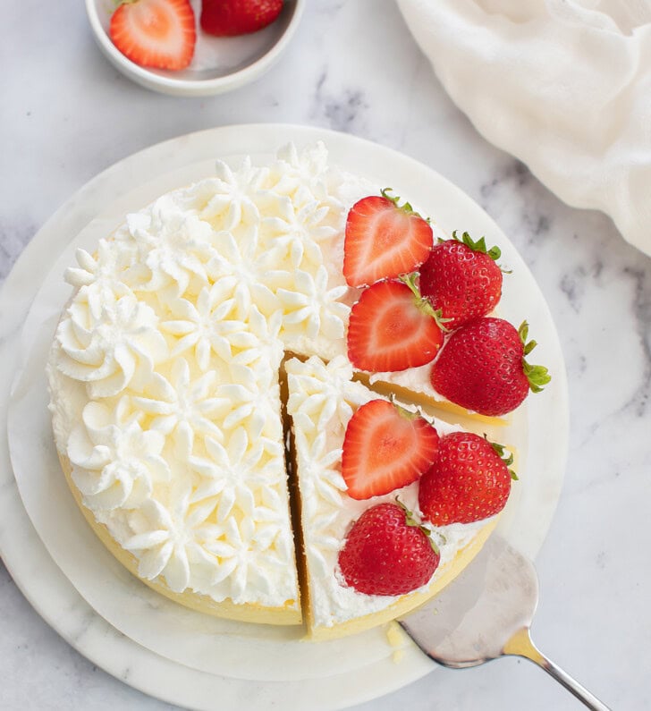 Taking a slice from a cottage cheese cake