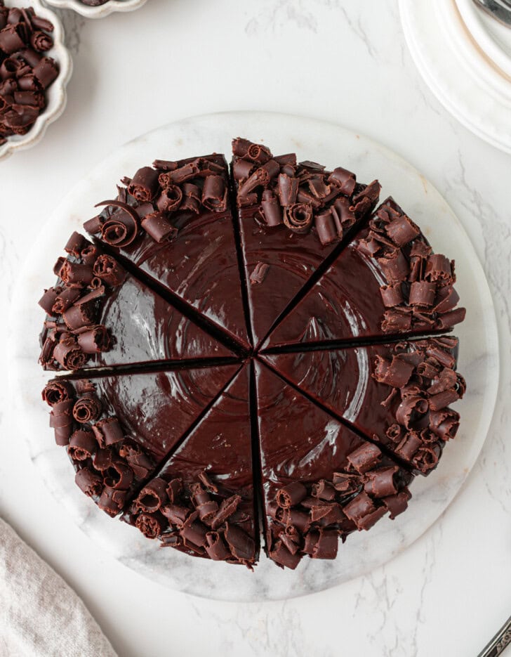 Chocolate cake decorated with frosting and chocolate curls
