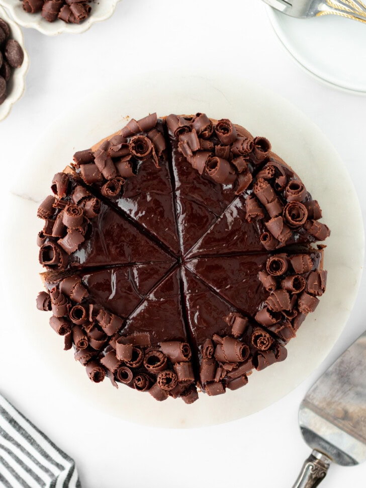 Chocolate cake decorated with frosting and chocolate curls