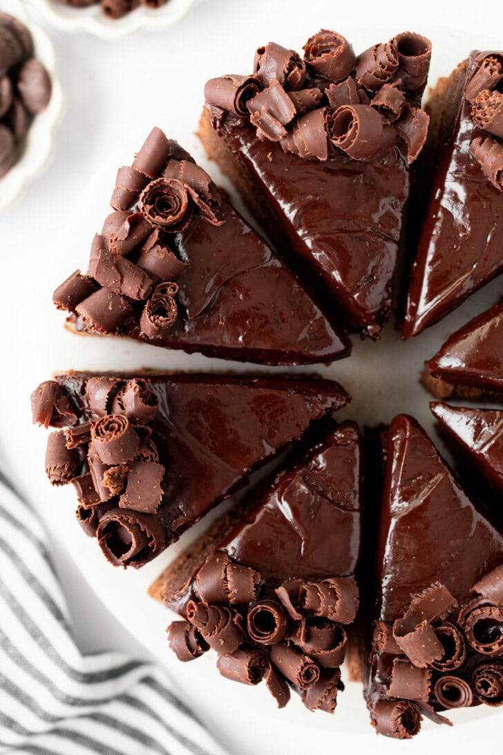 A decorated chocolate cake cut into slices