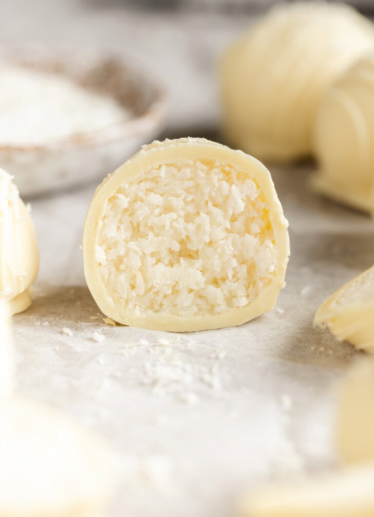 A coconut truffle cut in half