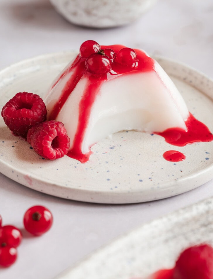 A bite taken from a piece of Panna Cotta