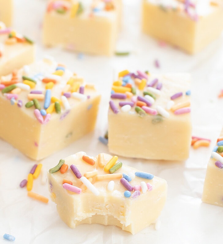A bite taken from a piece of Sugar Cookie Fudge