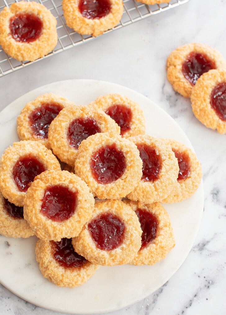 Thumbprint Cookies made with shredded coconut and jam in the center