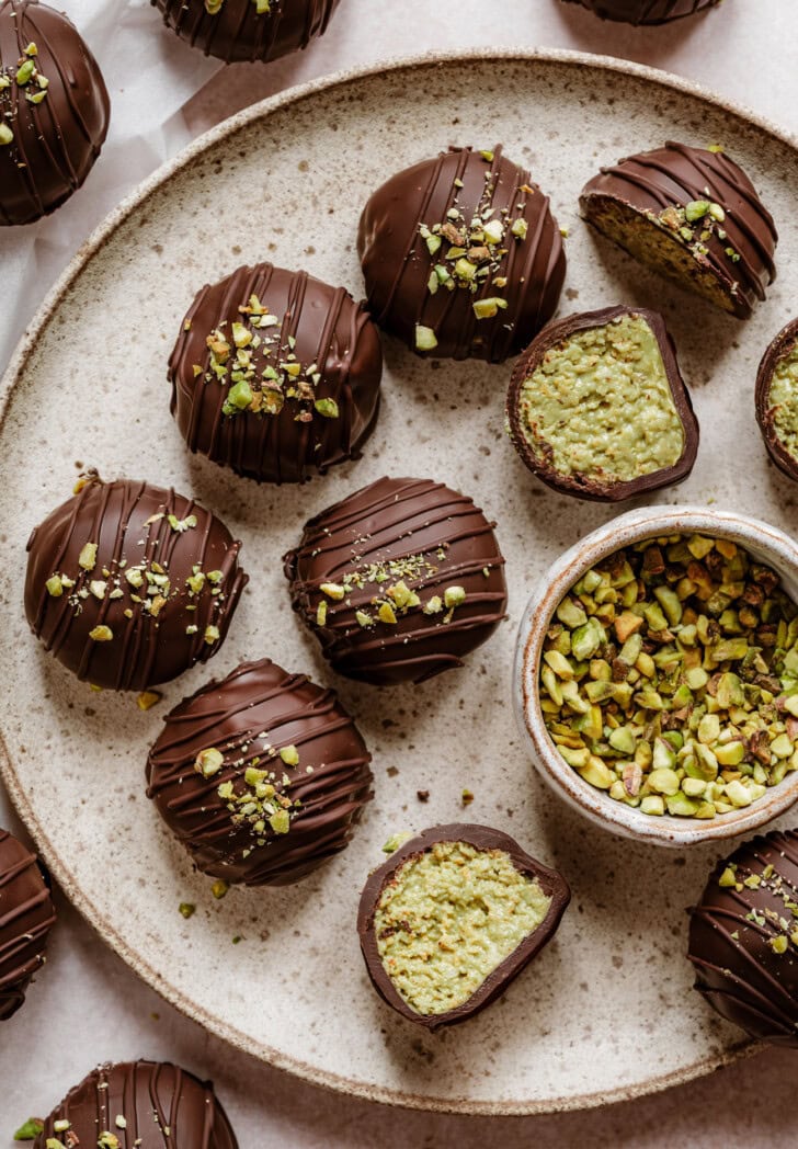 Dubai Truffles dipped in chocolate with a chocolate drizzle and chopped pistachios on top