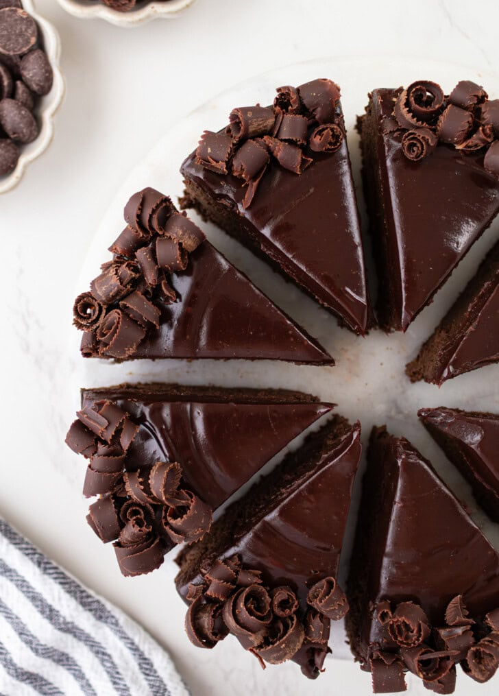 A decorated chocolate cake cut into eight slices