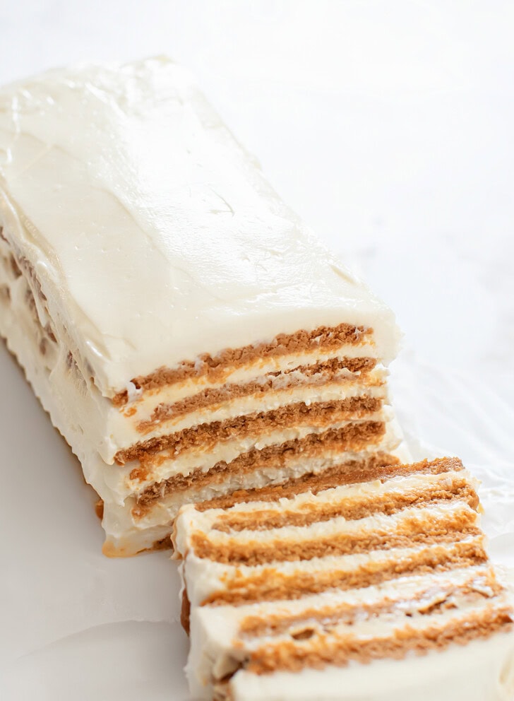 A no bake yogurt cheesecake with a slice cut from it