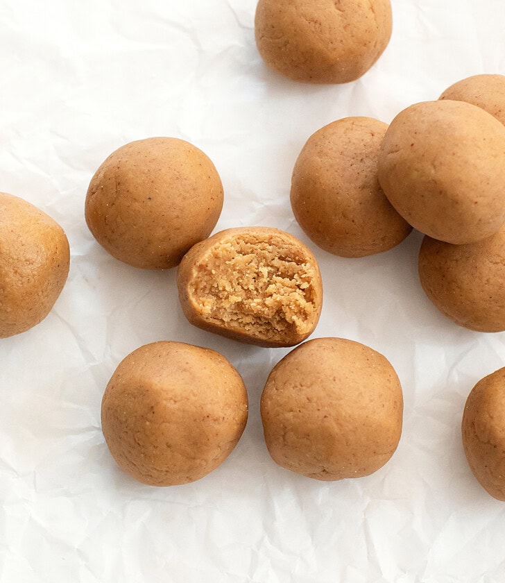 A peanut butter ball with a bite taken from it