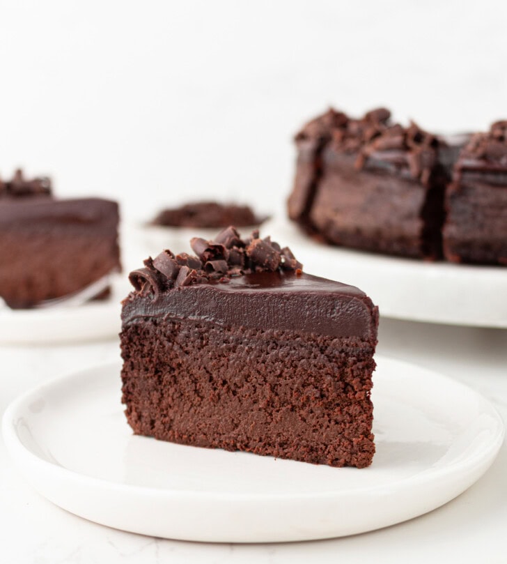 A slice of chocolate cake with chocolate frosting