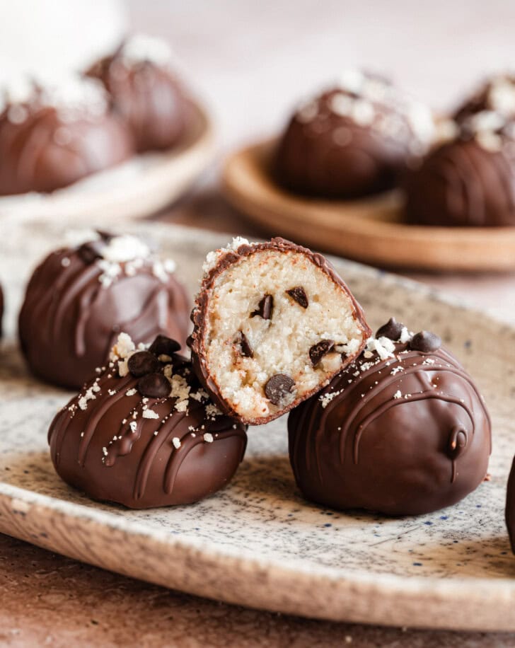 A Cottage Cheese Cookie Ball cut in half with chocolate chips in the middle
