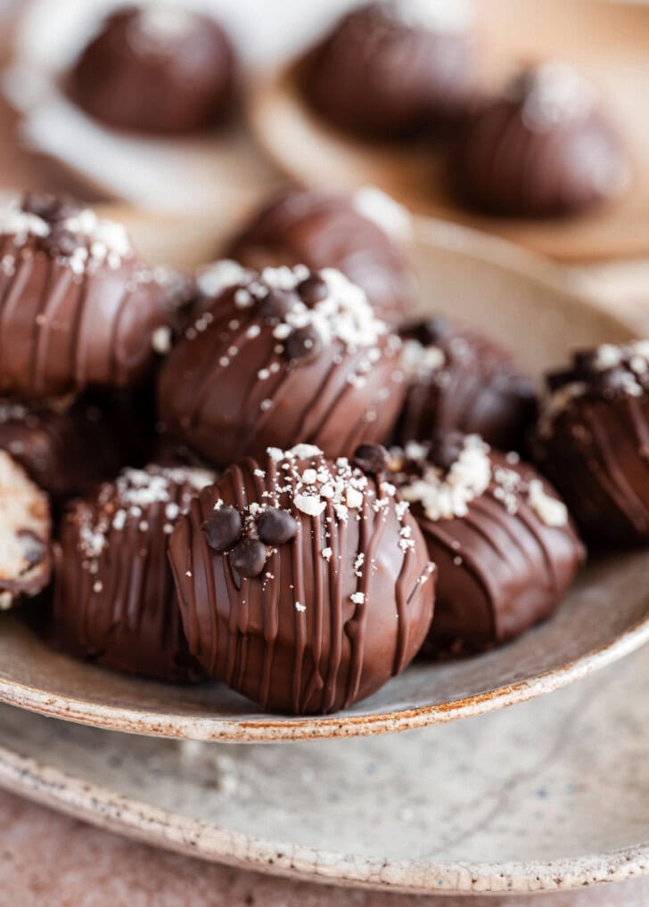 Cottage Cheese Cookie Balls with a chocolate drizzle and chocolate chips on top
