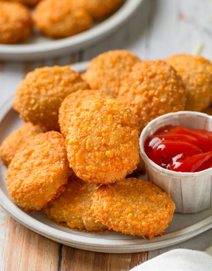 Keto nuggets on a plate with ketchup on the side