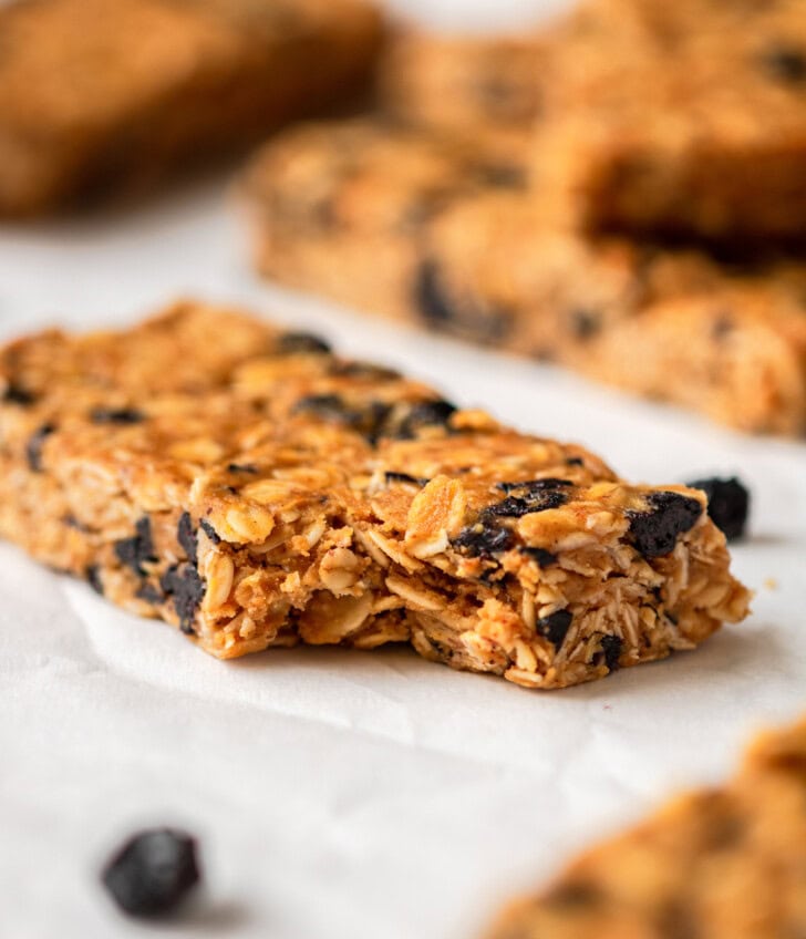 A bite taken from a soft and chewy granola bar