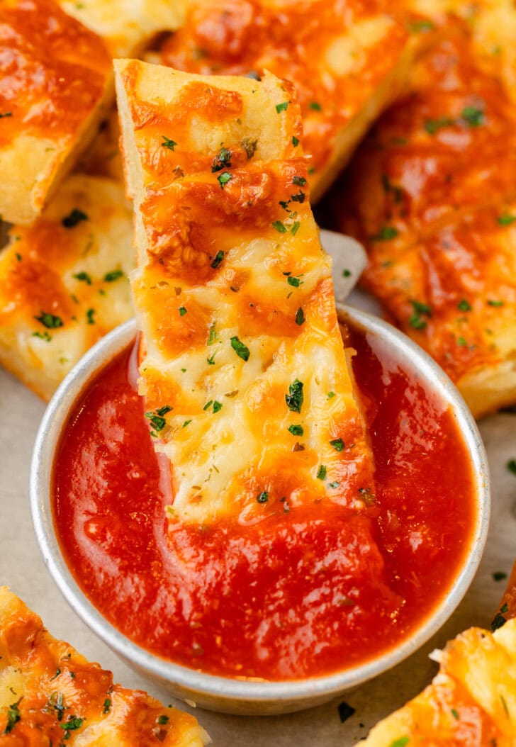 A Cottage Cheese Breadstick in dipping sauce