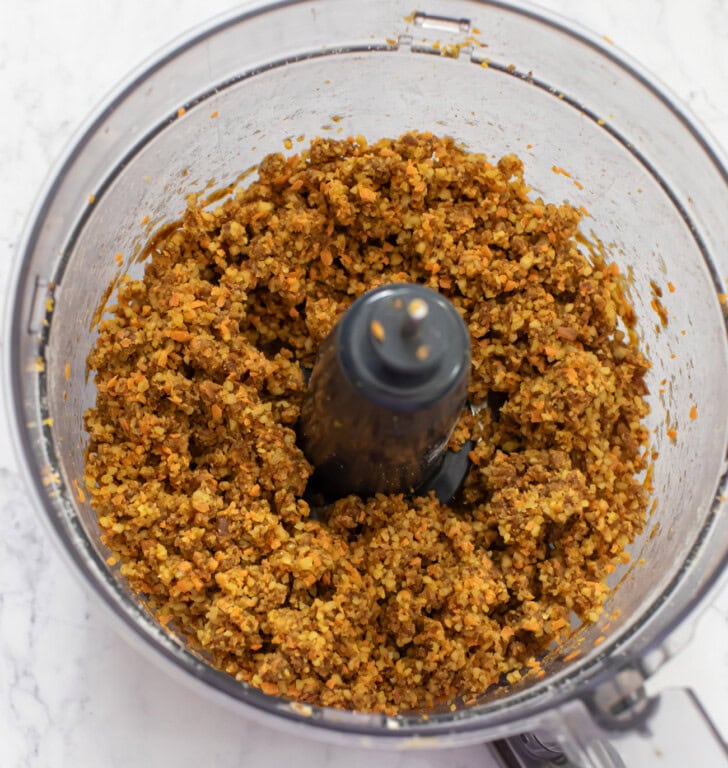 Ingredients for carrot cake bars blended in a food processor