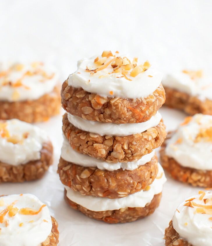 A stack of four frosted Carrot Oatmeal Cookies