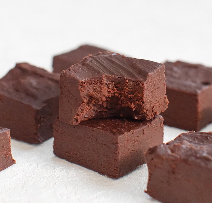 A piece of fudge with a bite taken from it